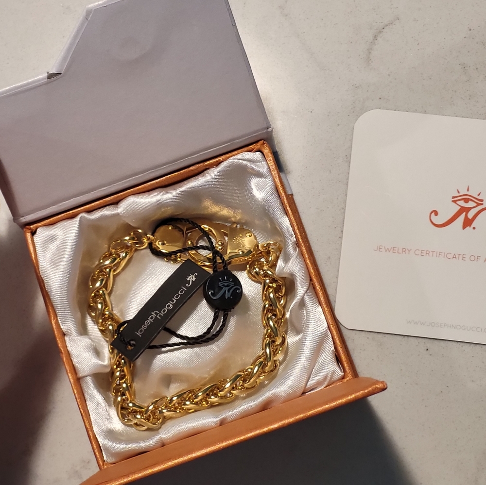 Gender neutral, new, with tags, box, coa. Joseph Nogucci Gold Handcuff Bracelet.